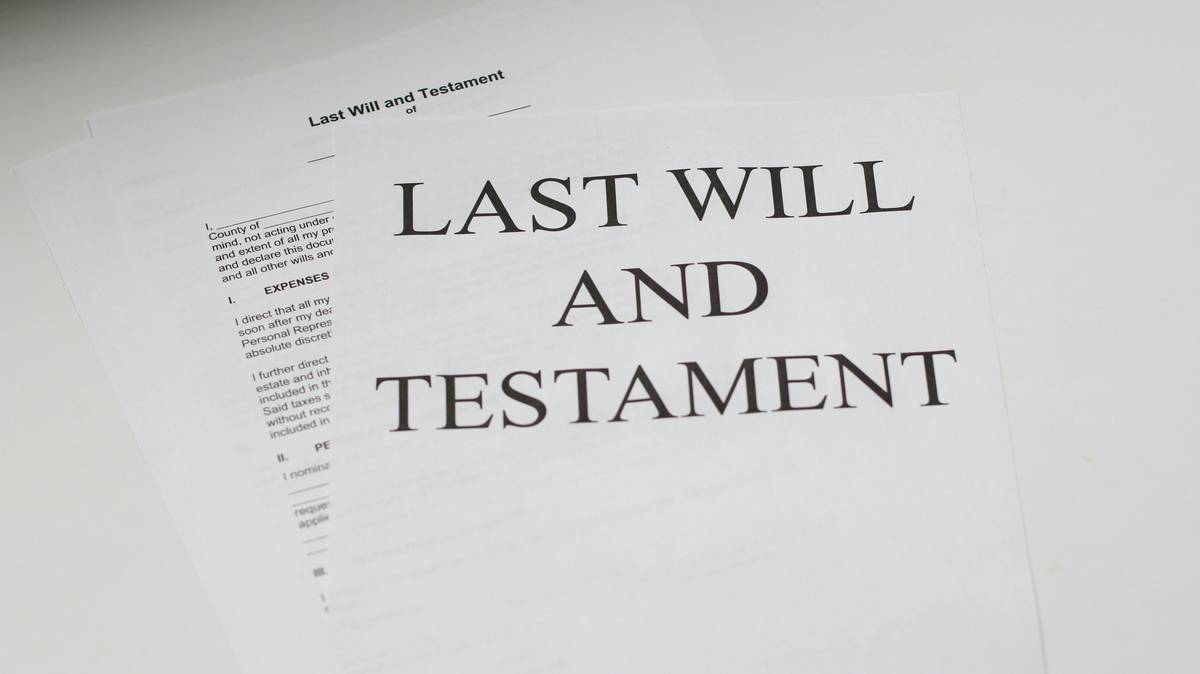 legal service estate management course bs student reviewing estate documents at desk